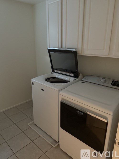 A white oven and microwave in a kitchen.