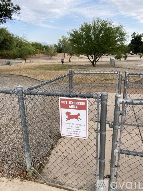 A sign on a fence reads "Pet Exercise Area".