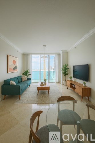 A balcony with a table and chairs overlooking a cityscape.