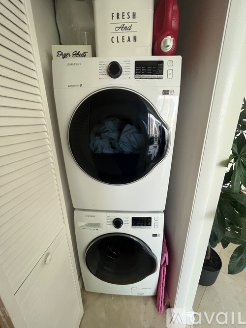 A white washing machine with the words Fresh and Clean written on it.