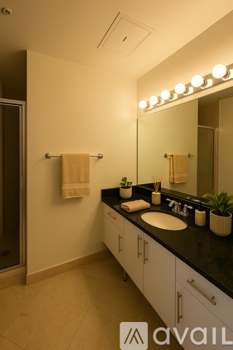 A dining room with a glass table and chairs.