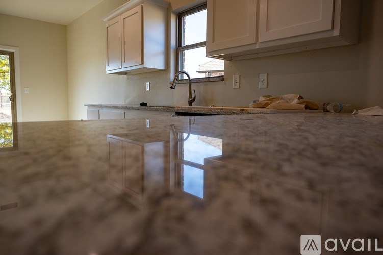 A kitchen under construction with cabinets and a countertop.