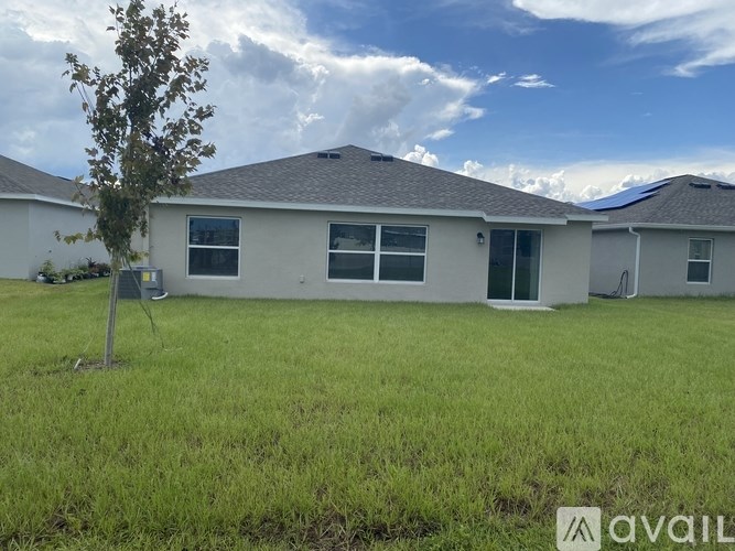 A house with a tree in front of it.