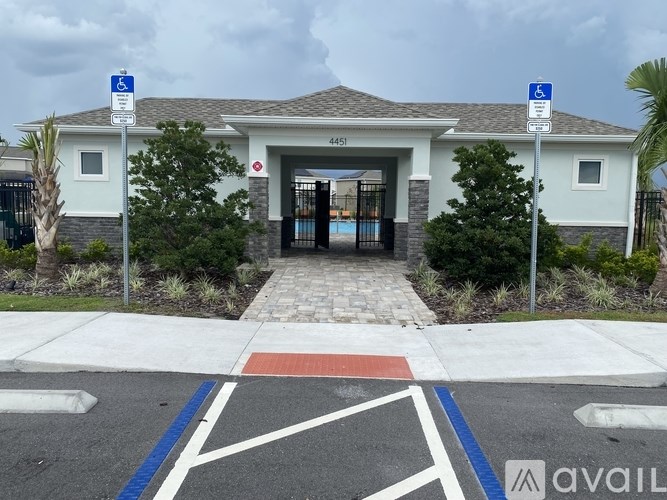 A building with a parking lot in front of it.