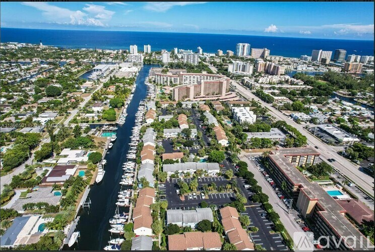 A bird's eye view of a city with a river running through it.