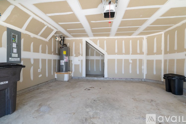 A room with a lot of white walls and a ceiling with a light fixture.