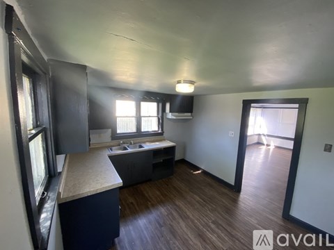 A kitchen with a sink and a window.