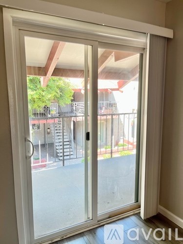 A white sliding door with a glass window.