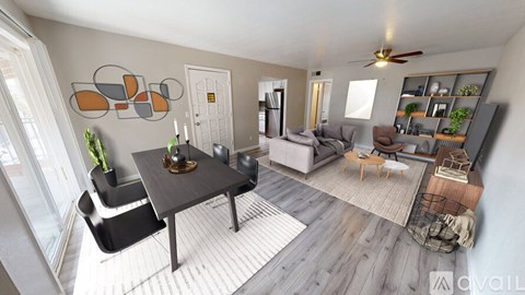 A modern living room with a dining table and chairs.