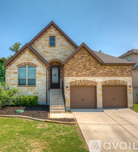 A house with a brown garage door is for sale.
