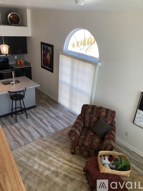 A kitchen with a counter and a chair.