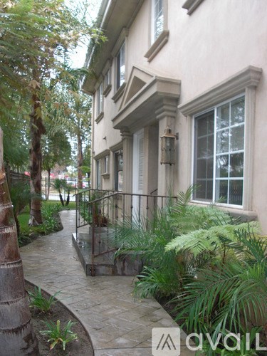 A house with a tree in front of it.