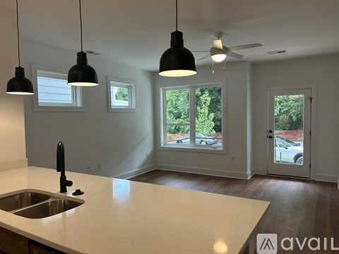 A kitchen with a sink and a window.