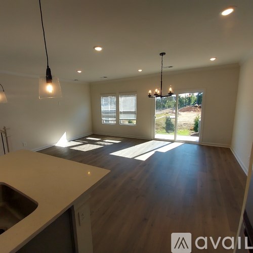 A kitchen with a sink and a window.