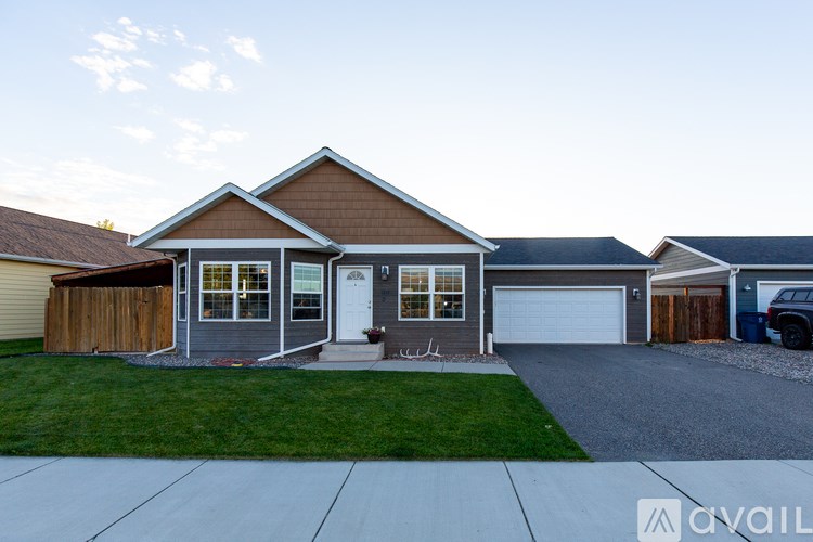 A house with a brown roof and a white door is shown.