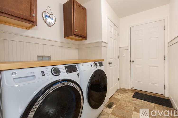 A laundry room with a washer and dryer.