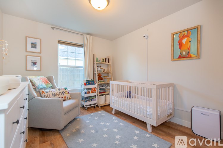 A baby room with a crib and a changing table.