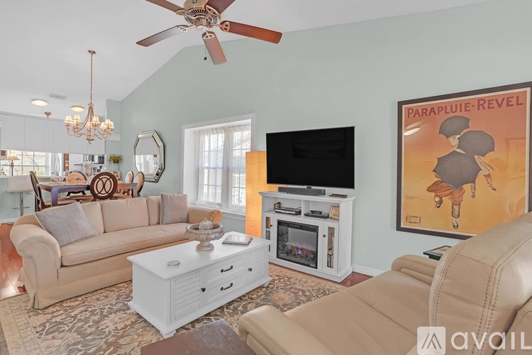 A white desk with a chair and a lamp on it.