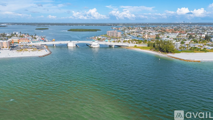 A cityscape with a bridge over a body of water.