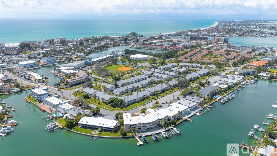 A bird's eye view of a coastal city with a marina.