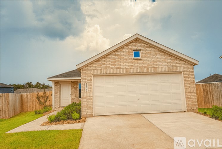 A house with a garage is for sale.