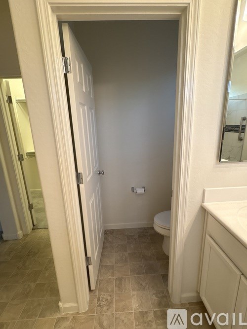 A bathroom with a toilet and sink.