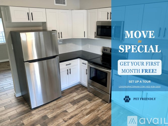 A kitchen with a refrigerator, cabinets, and a stove top oven.