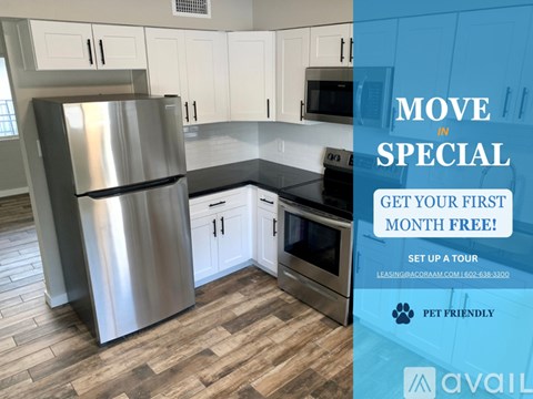 A kitchen with a refrigerator, cabinets, and a stove top oven.