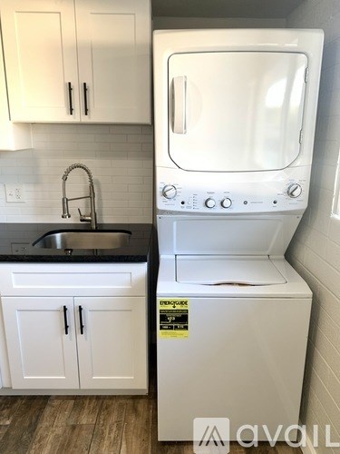 A white oven and sink in a kitchen.