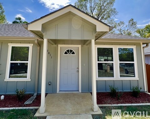 A house with a white door and a small porch.