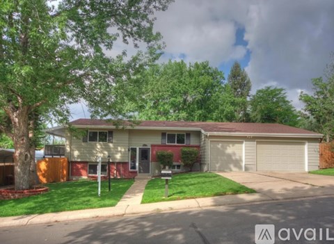 A house with a tree in front of it.