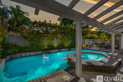 A pool with a flamingo design in the middle of it.