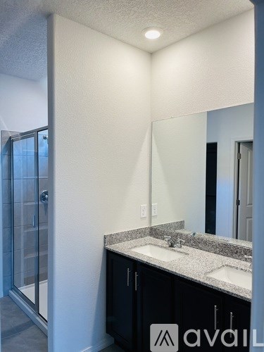 A bathroom with a sink and mirror.