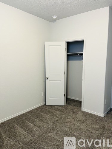 A room with a door and a window.