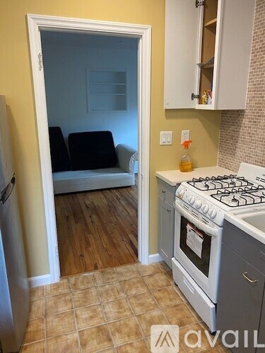 A kitchen with a stove and a refrigerator.