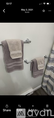 A towel is hanging on a towel rack in a bathroom.