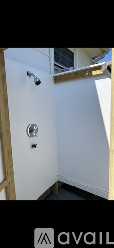 A white wall with a black square in the middle.