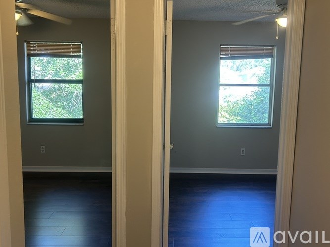 Two empty rooms with one window each.