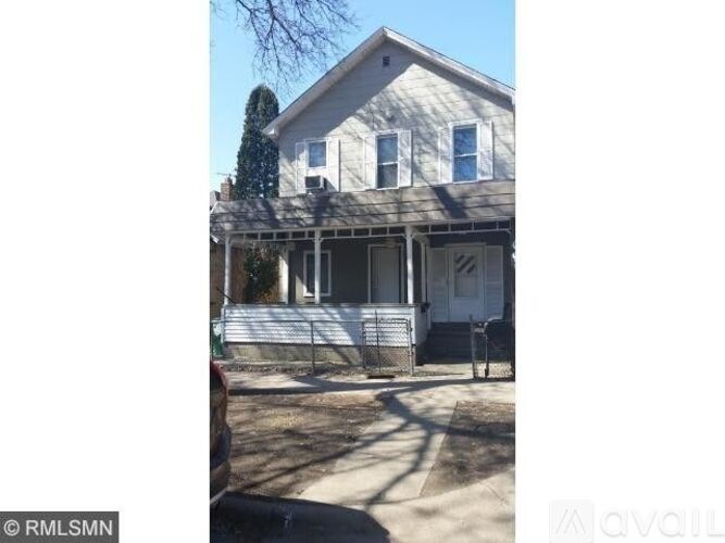 A house with a white door and a porch.