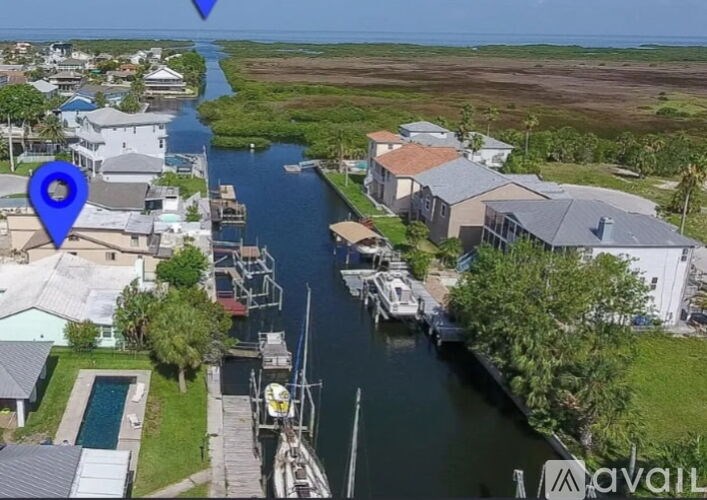 A blue marker is on a house in a residential area.