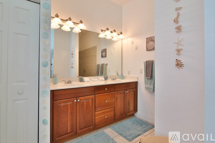 A bathroom with a vanity and a mirror.