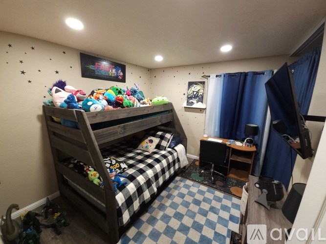 A room with a bunk bed and a checkered floor.