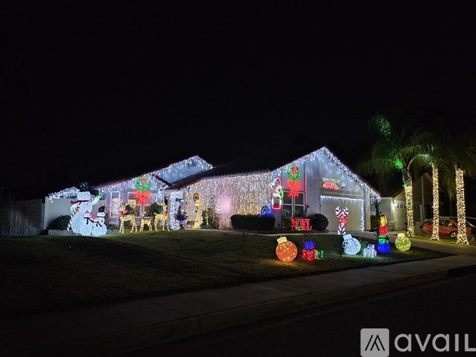 A house is decorated with Christmas lights and ornaments.