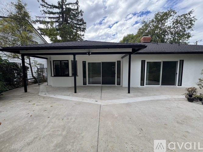 A house with a covered patio area is for sale.