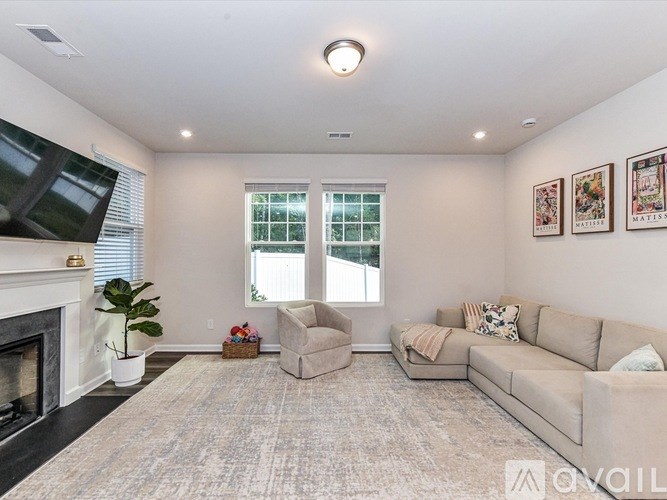 A living room with a fireplace and a couch.