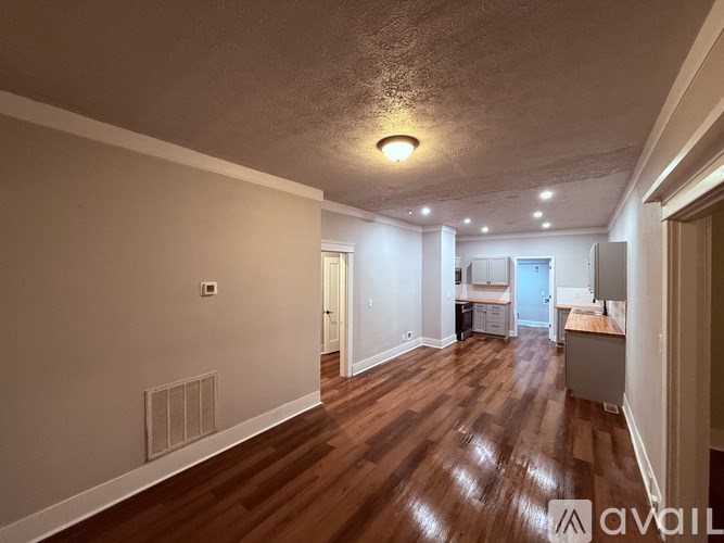 A house with a wooden staircase leading to a door.