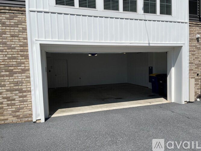 A staircase with a beige carpeted runner and wooden banister.