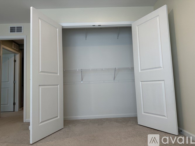 A bathroom with a toilet, sink, and shower.