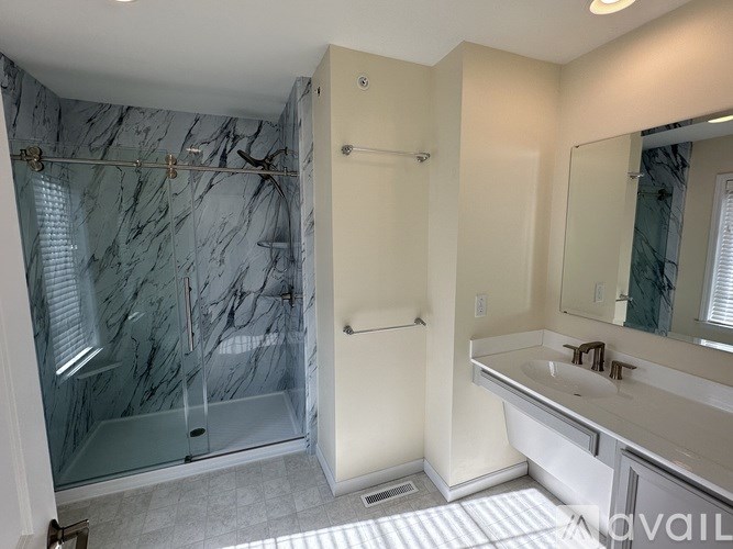 A room with green walls and carpeted floor.