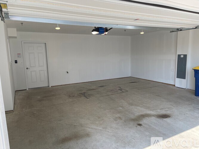 A bridge over a pond with a building in the background.
